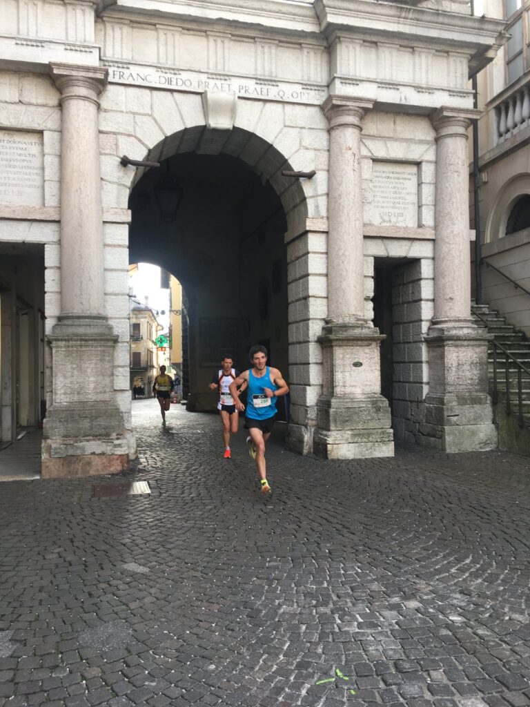 Mikael Mongiovetto, 29, from Aosta, former bocce world champion and runner-up at the Tor des Géants, comes out of Porta Dojona on his way to a solo win in the half marathon.
